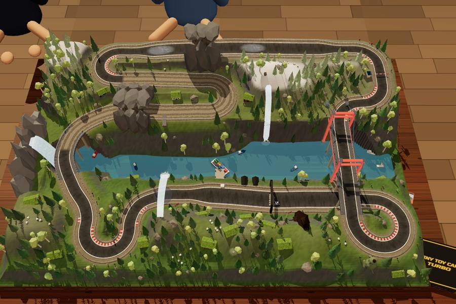 A green fjord diorama with waterfalls and a red bridge