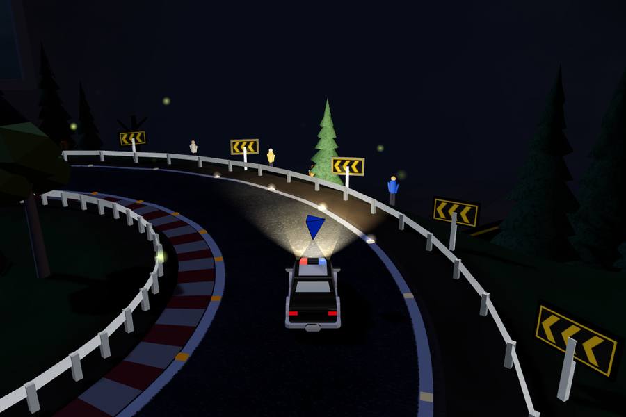 A police car lighting up a night road with its headlights