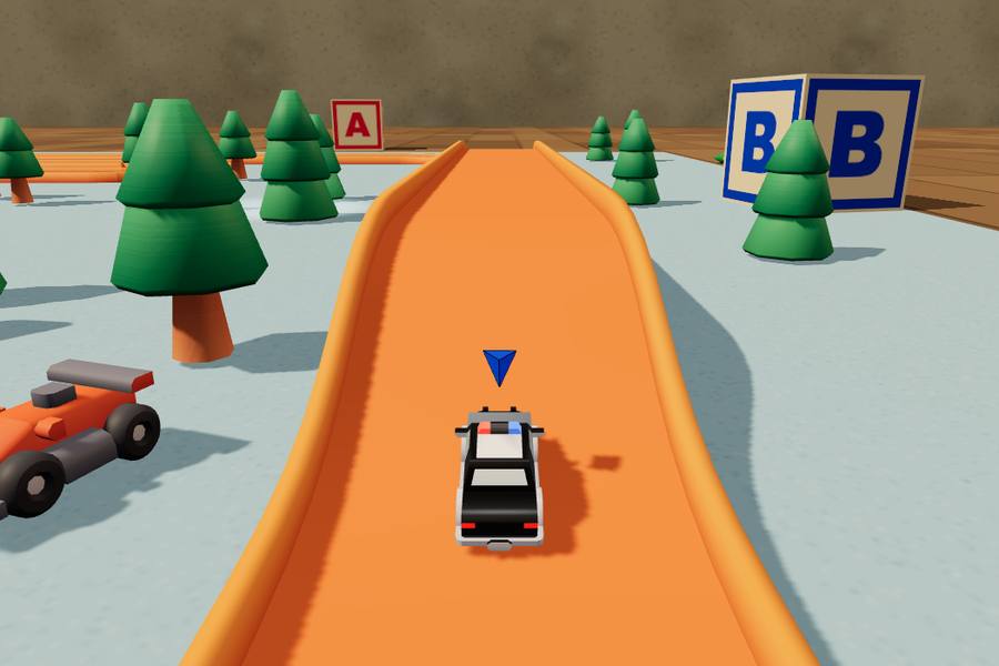 An orange plastic toy track among building blocks and toy trees